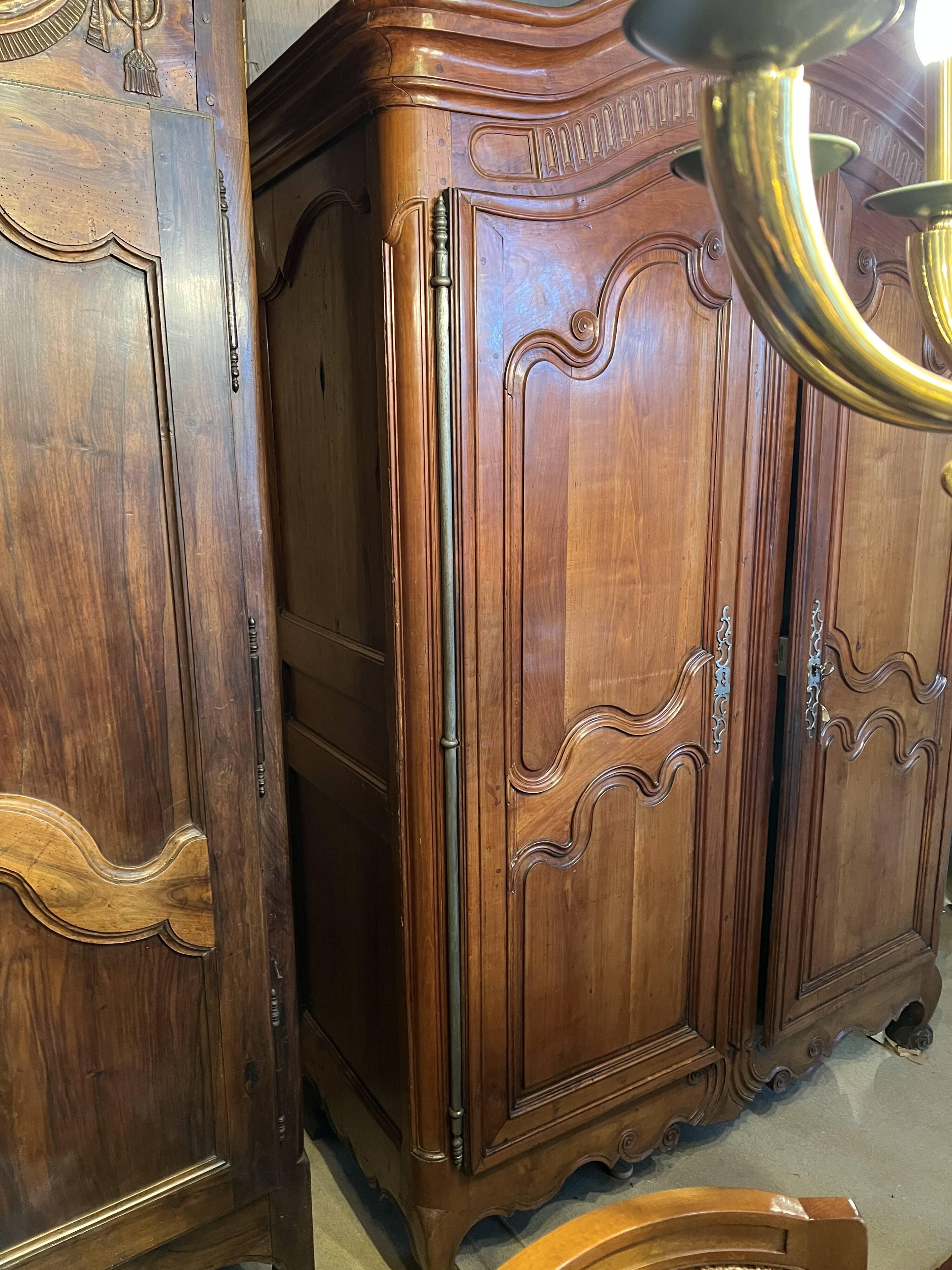 Louis XV wardrobe with two doors, Cherry wood. 18th century.