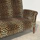 Vintage leopard velvet sofa / wall sofa with drop-down arms, France.