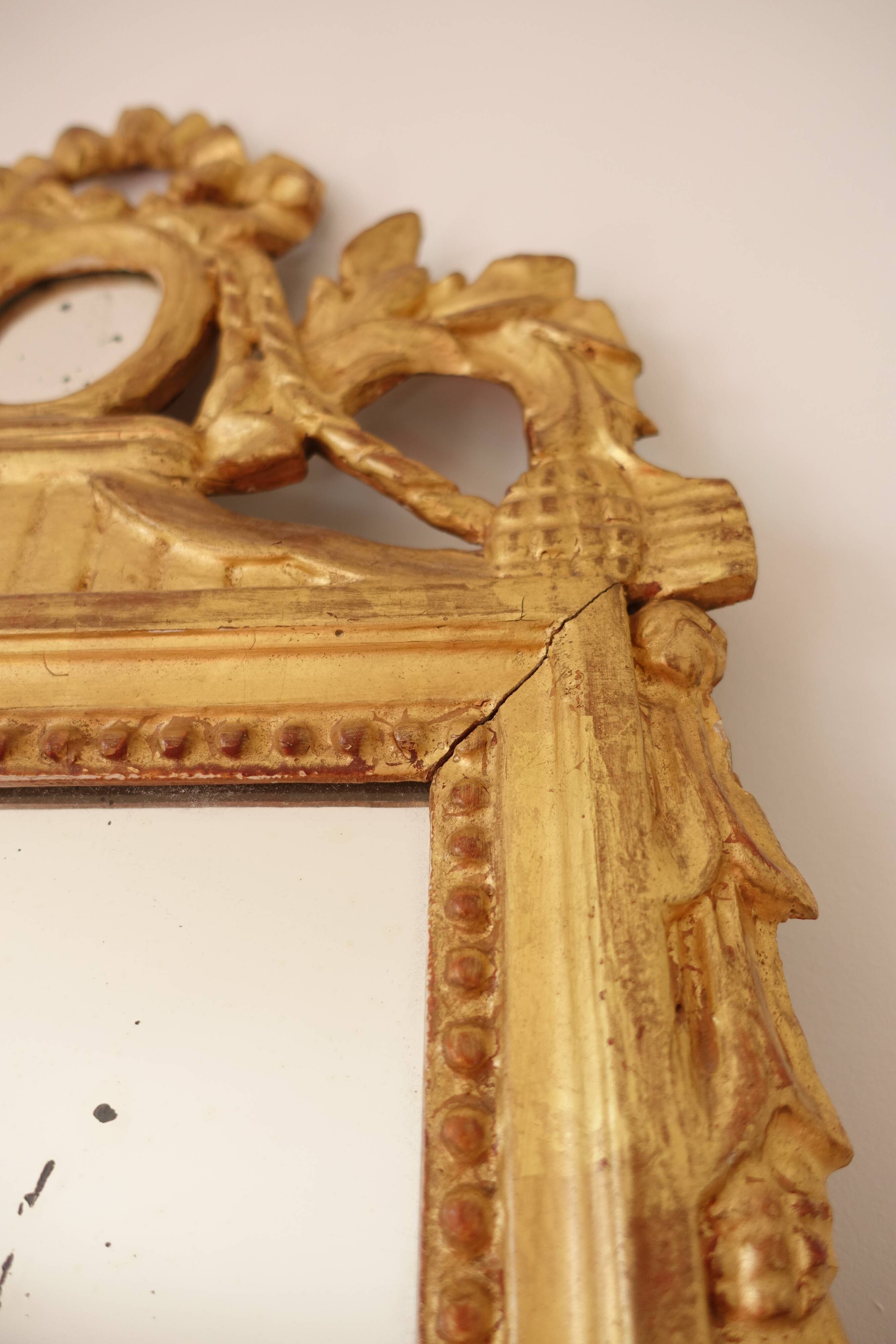 Miroir Louis XVI en bois doré 35x 65cm