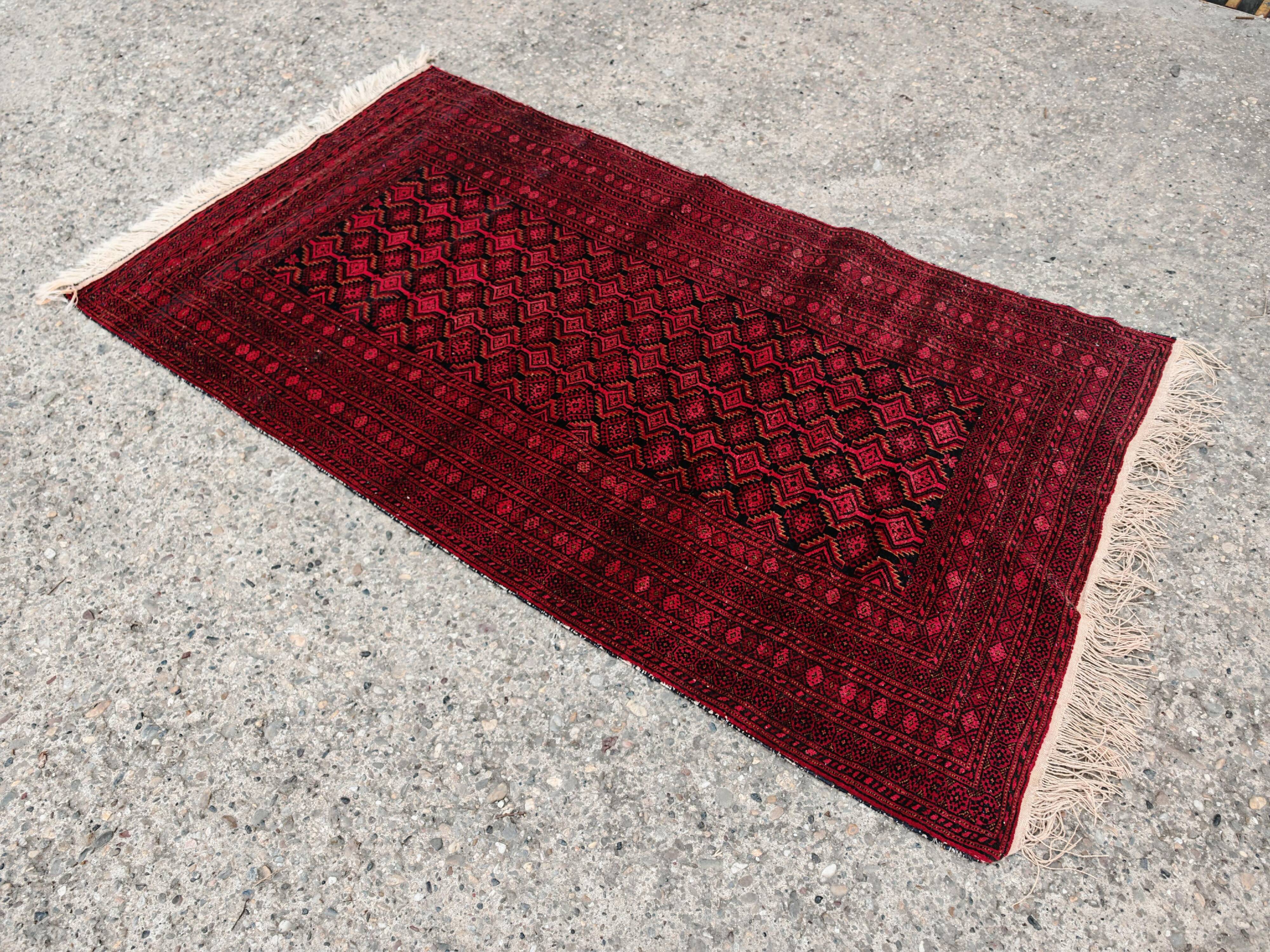 Vintage Baluch carpet handmade from natural wool, Afghanistan 1960.