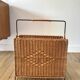 large wicker / rattan and black iron magazine rack from the 70s