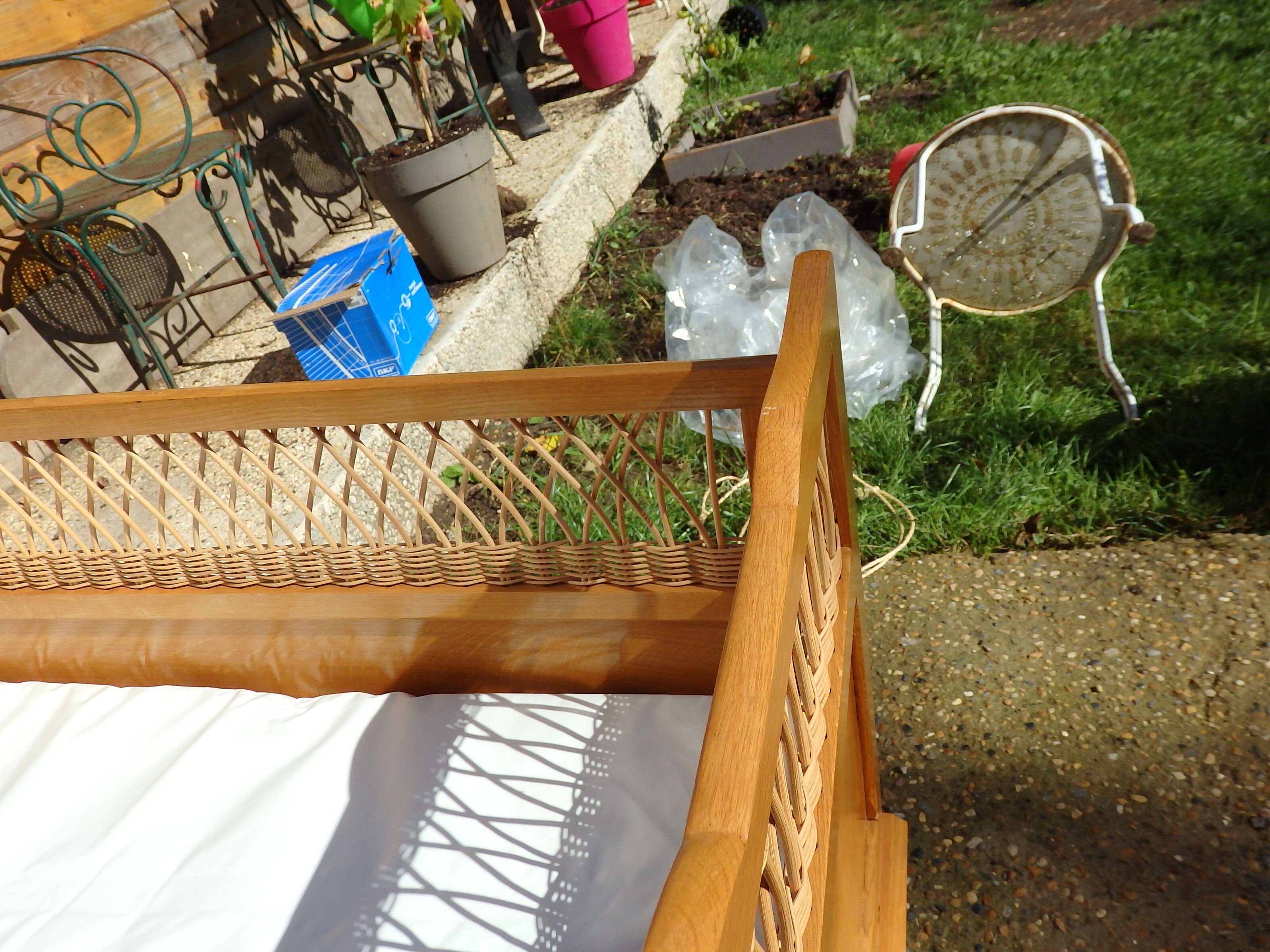 Vintage baby bed in rattan