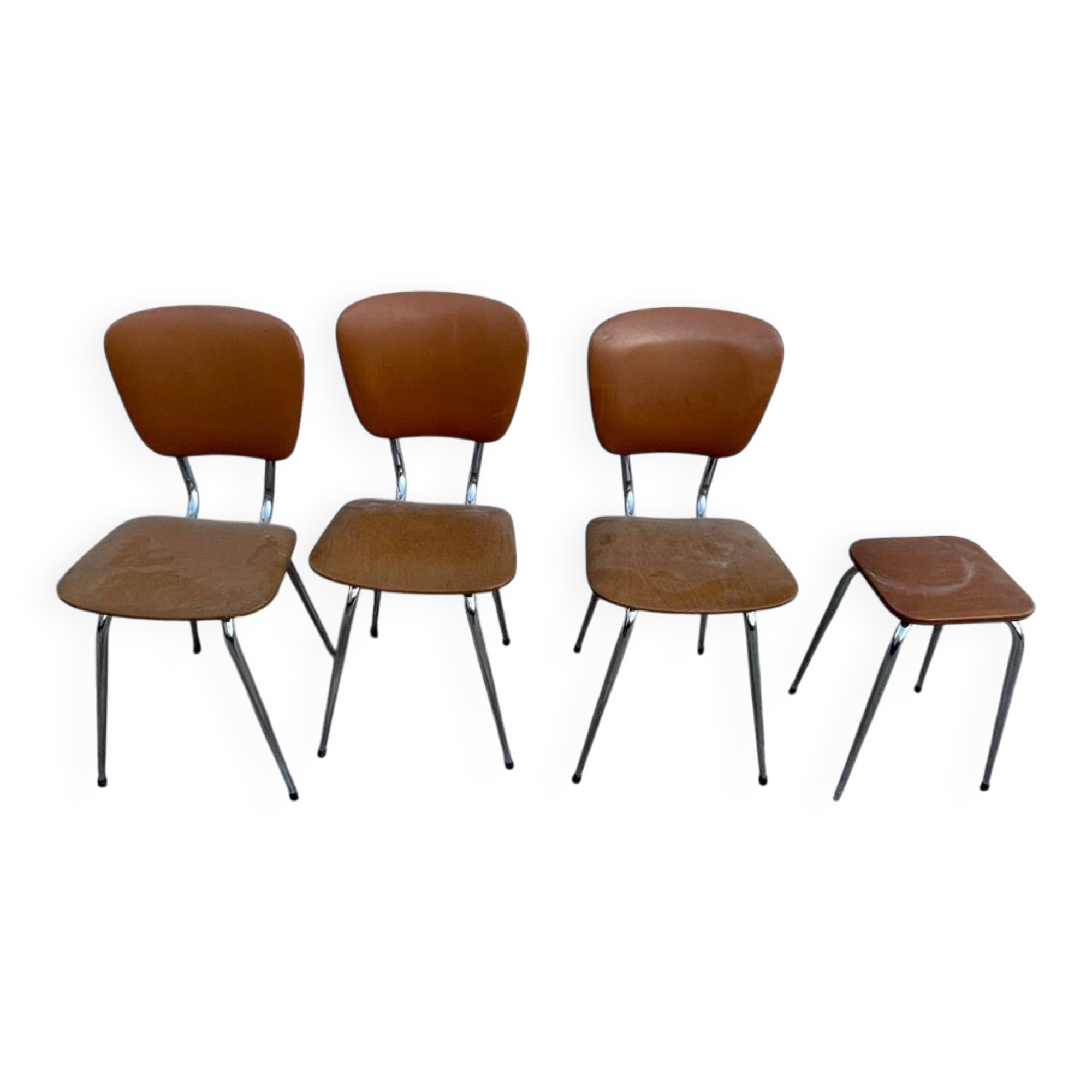 3 chairs and a vintage stool in faux leather and tubular design.