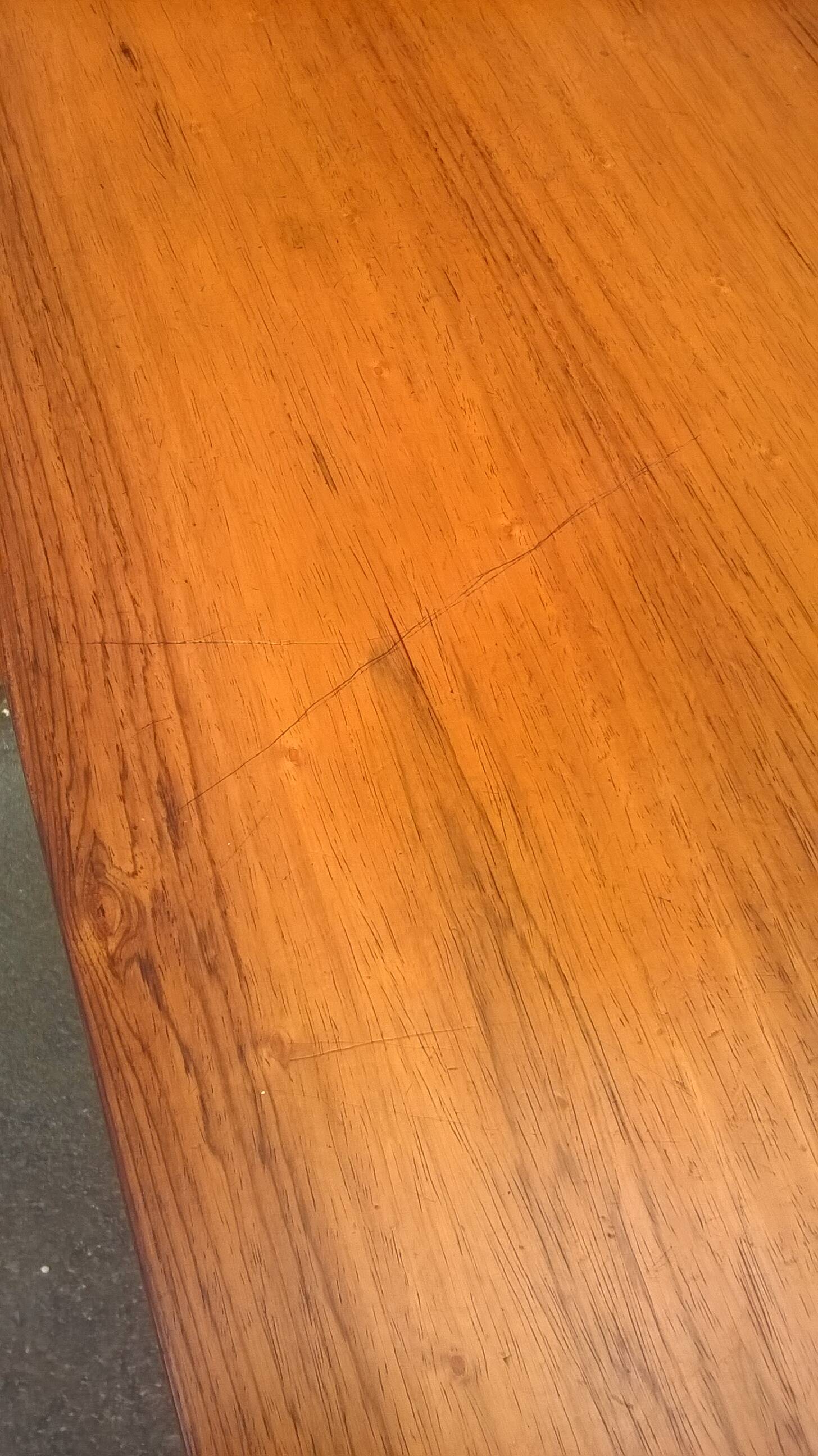 Extendable teak dining table