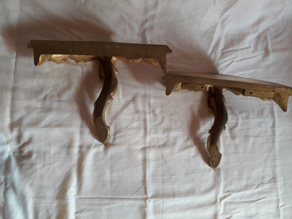 2 small golden wall shelves