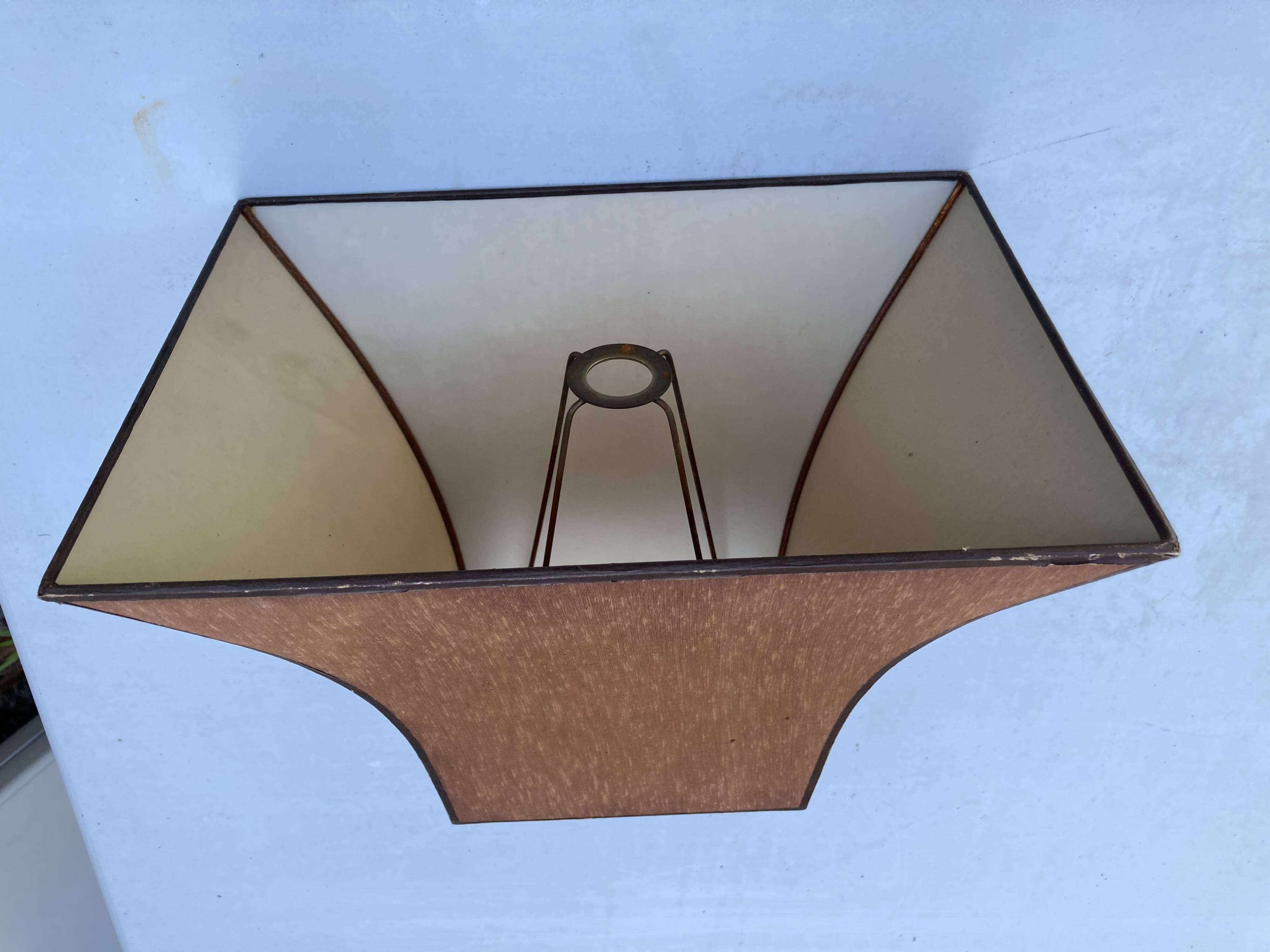 Old vintage lamp representing a duck in silver metal with wooden base