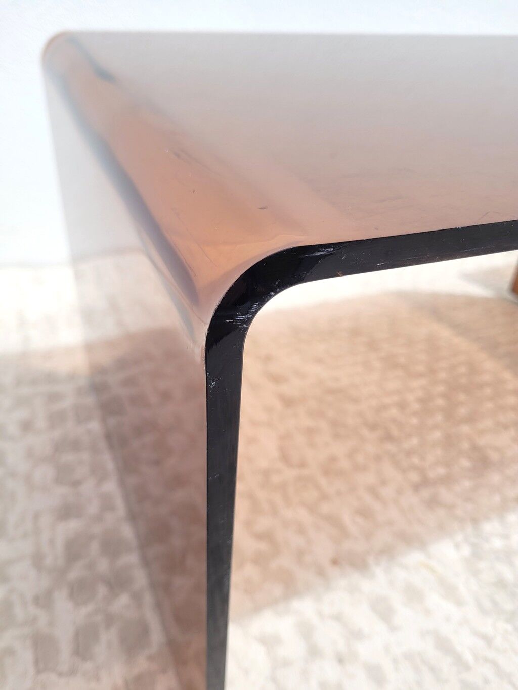 Pair of vintage smoked plexiglass nesting tables.