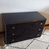 Lacquered black chest of drawers, golden brass