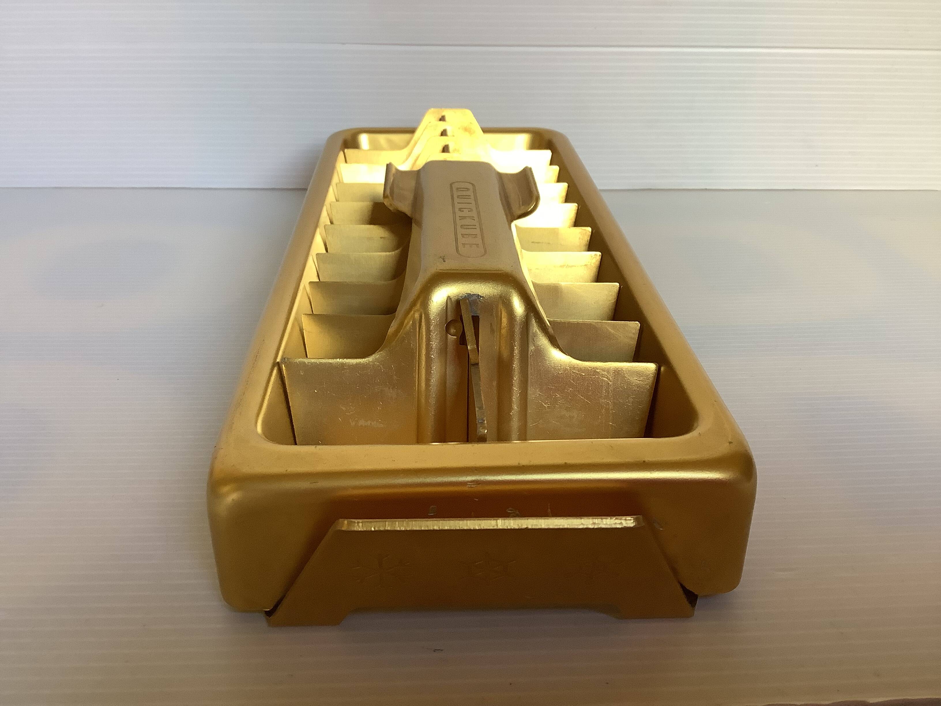 Old gold metal ice cube tray
