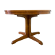 Expandable round table with butterfly extension