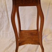 Antique Art Nouveau pedestal table with carved wood and marble top.