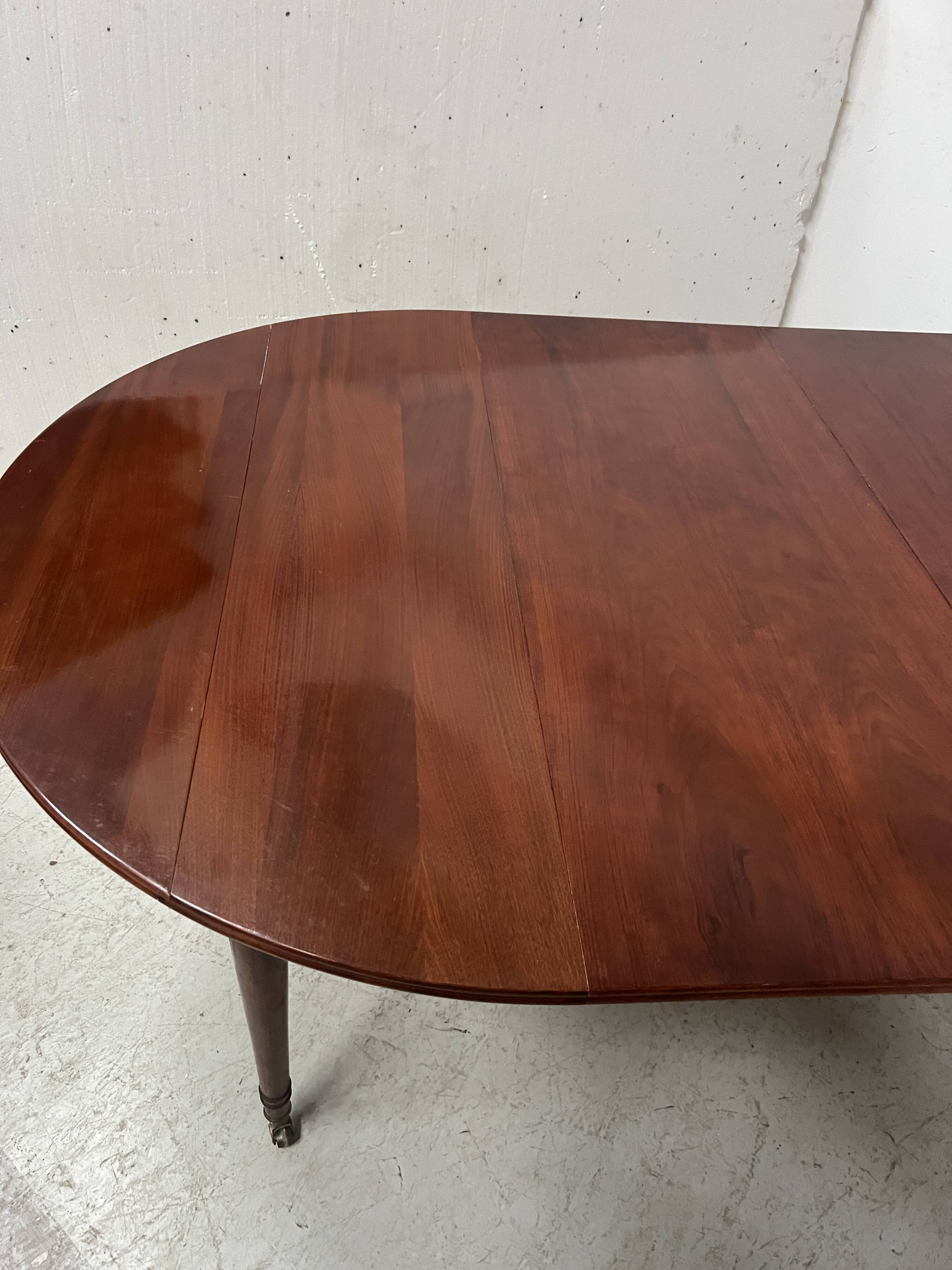 A six-foot Louis XVI style mahogany table from the 19th century.
