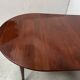 A six-foot Louis XVI style mahogany table from the 19th century.