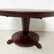 Empire style round table with claw feet, 19th century.