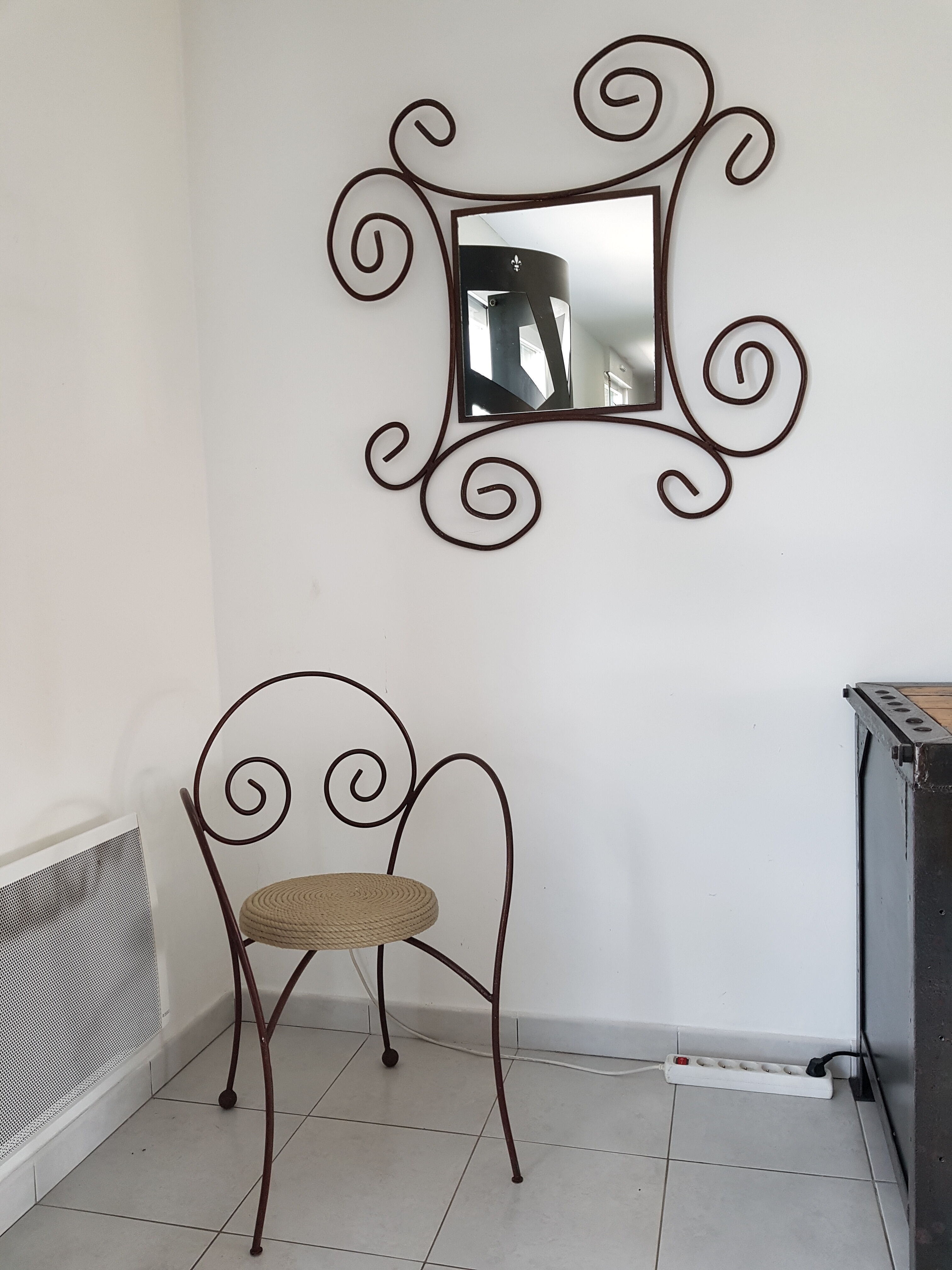 Wrought iron and rope chair