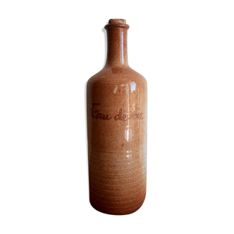 Vintage Mongolian sandstone brandy bottle