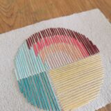 Rainbow embroidery on rag paper
