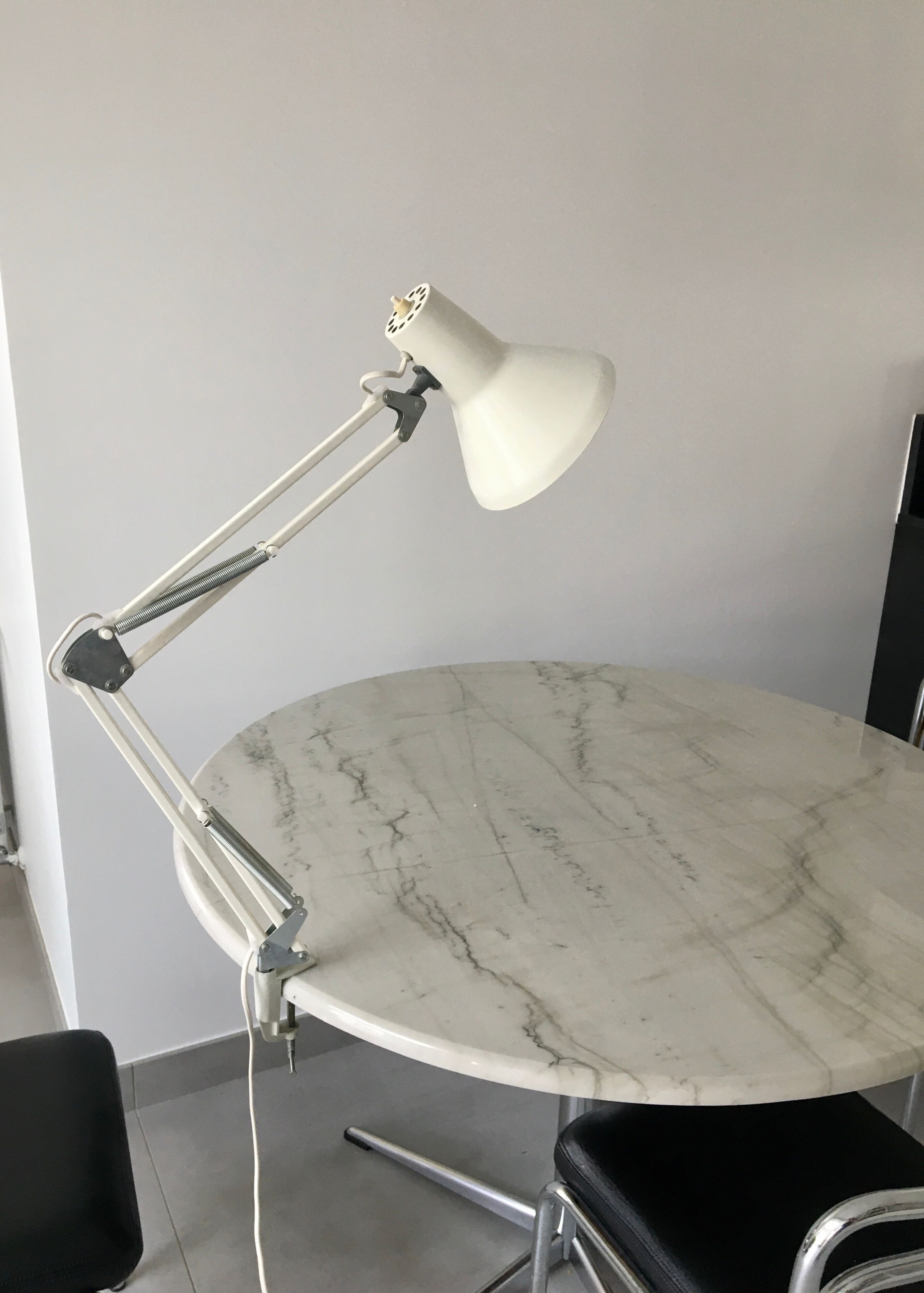 Off-white articulated architect lamp.