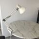 Off-white articulated architect lamp.