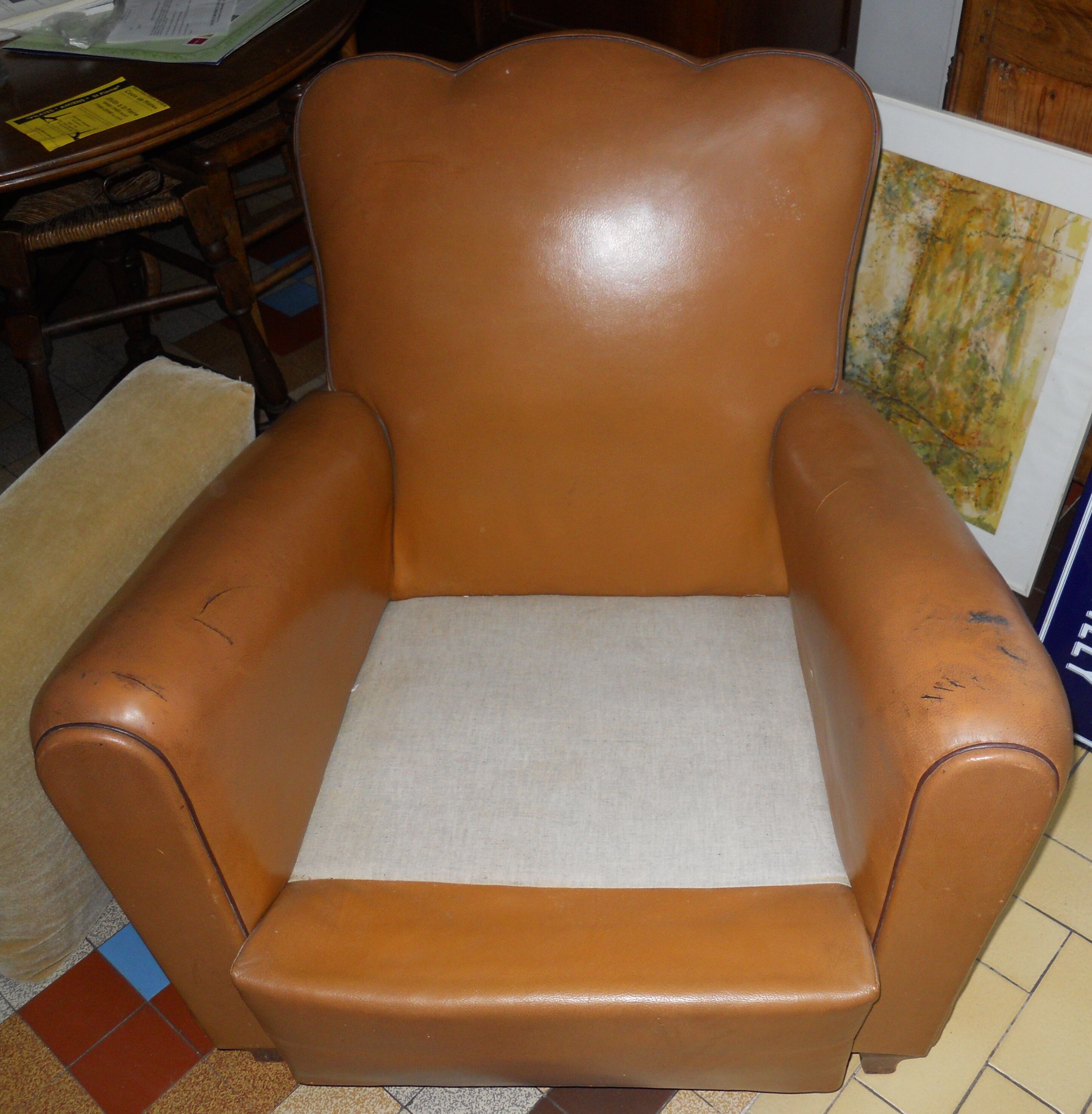 Brown leather club armchair