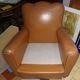 Brown leather club armchair