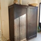 Old black wardrobe - wooden drawers and labels of origin