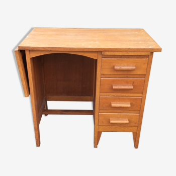 Bureau vintage en chêne à piétement compas avec 1 tablette extensible à 4 tiroirs et 1 tirette.