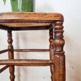 Wooden stool with cane seat