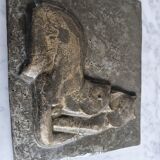 Bas-relief plaque of a rabbit in brown patina, seated cat