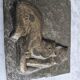 Bas-relief plaque of a rabbit in brown patina, seated cat