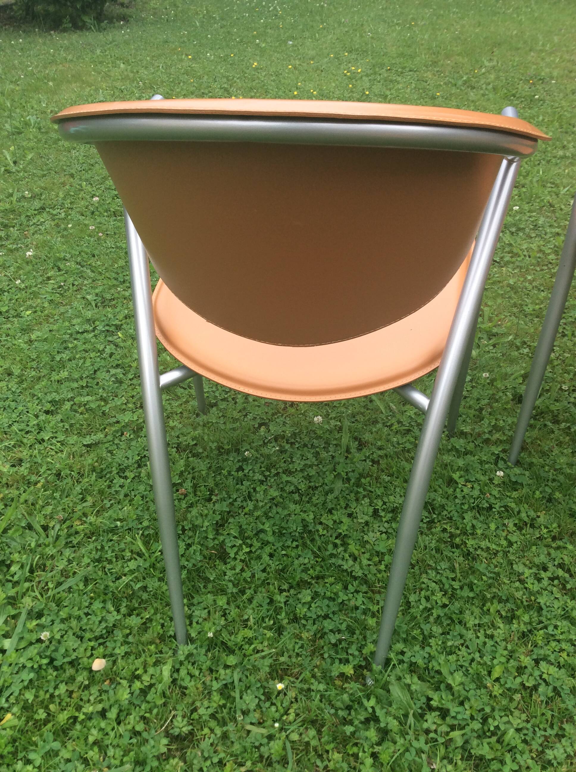 Leather and metal armchairs