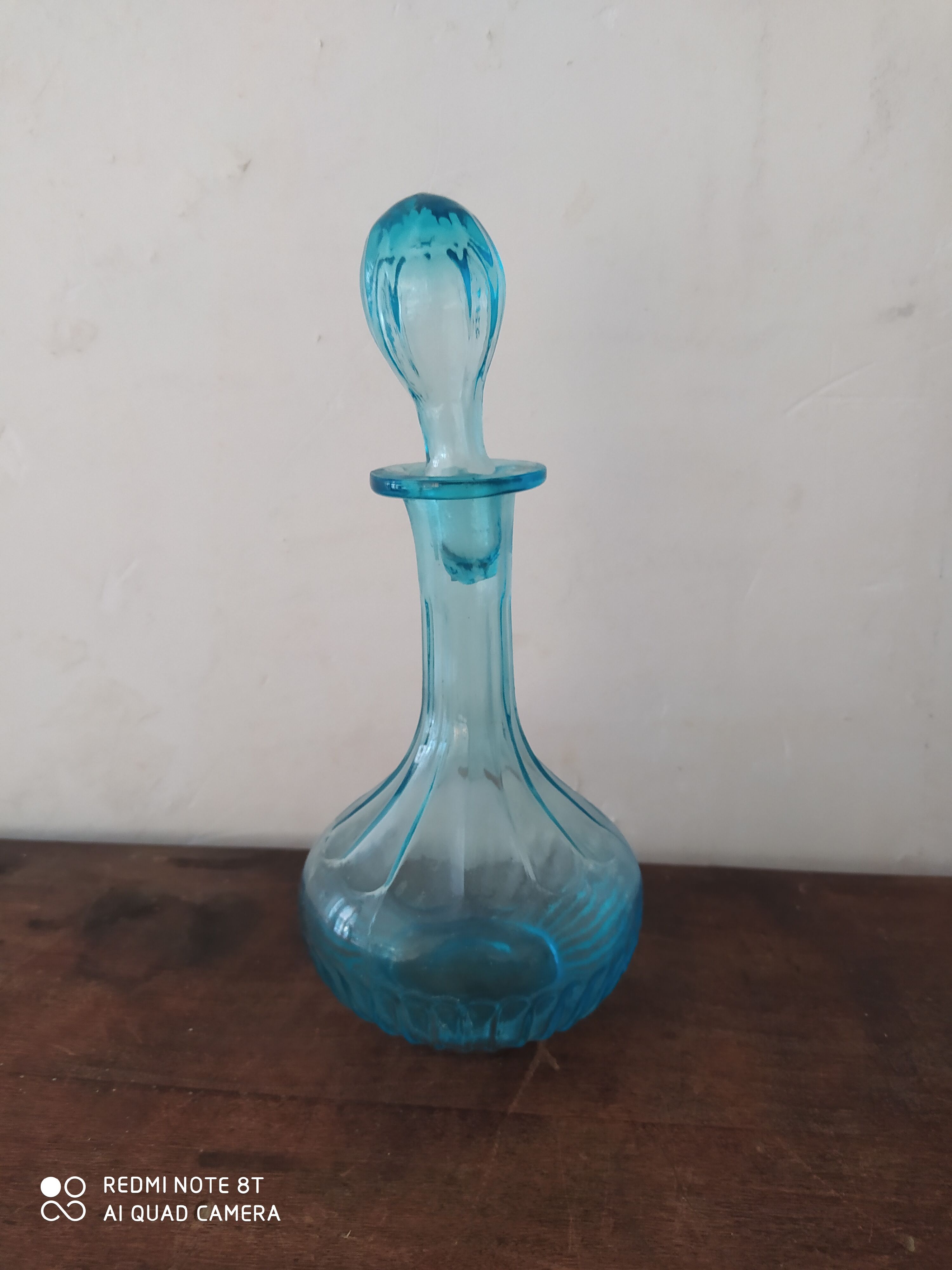 Set including a bottle and a turquoise blue glass jar