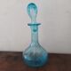 Set including a bottle and a turquoise blue glass jar