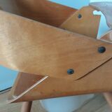 Baumann Baby Coquille children's armchair in bent wood with splayed legs.