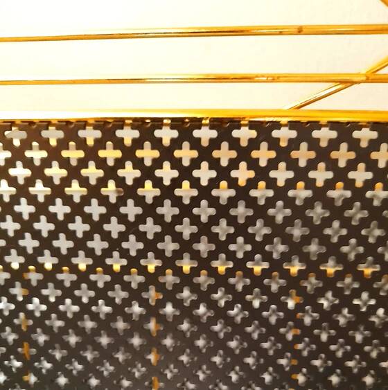 Perforated metal magazine rack, 1950