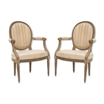 Pair of Louis XVI-style convertible armchairs