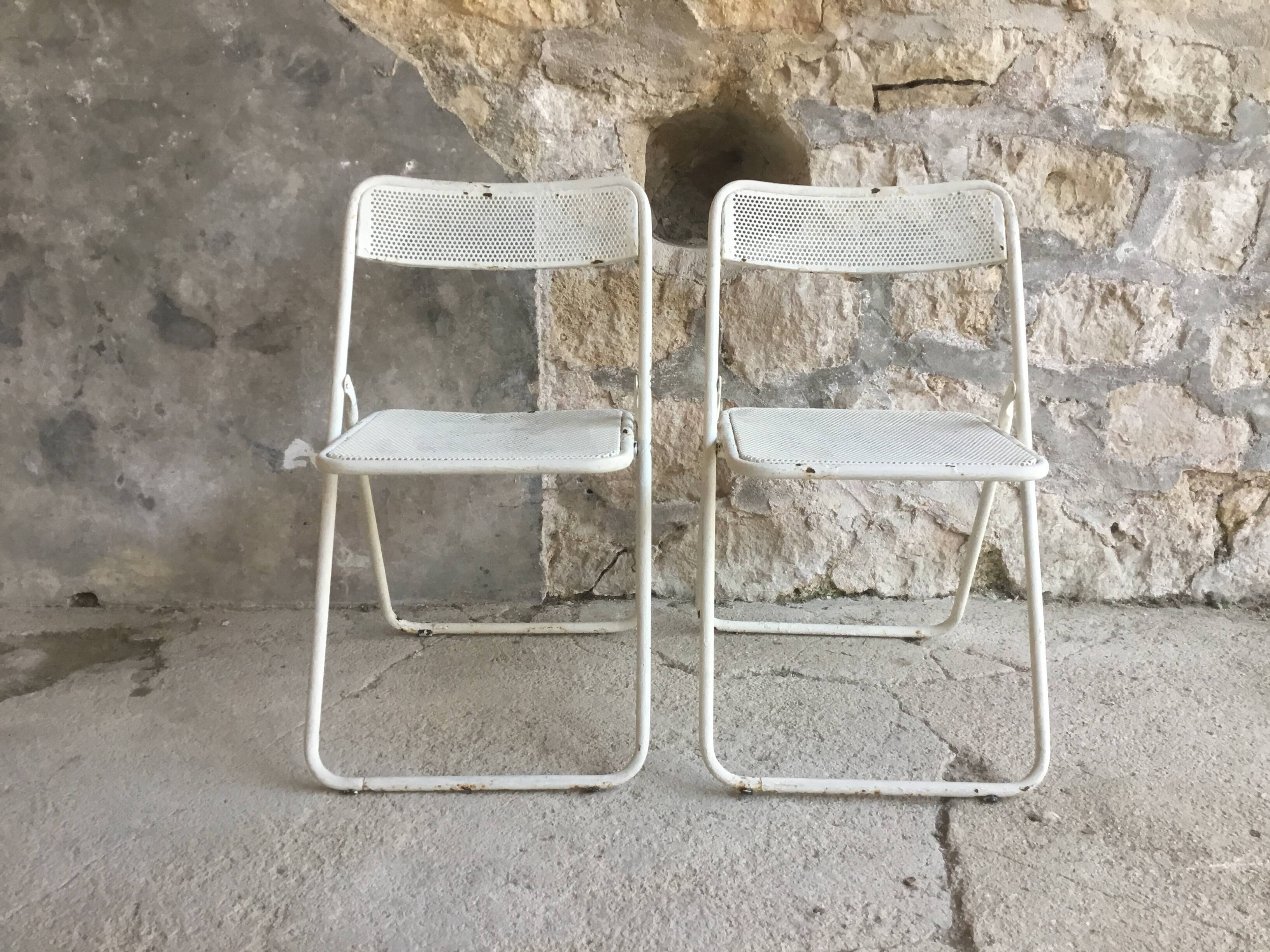 Pair of white perforated metal folding chairs - vintage