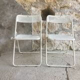 Pair of white perforated metal folding chairs - vintage