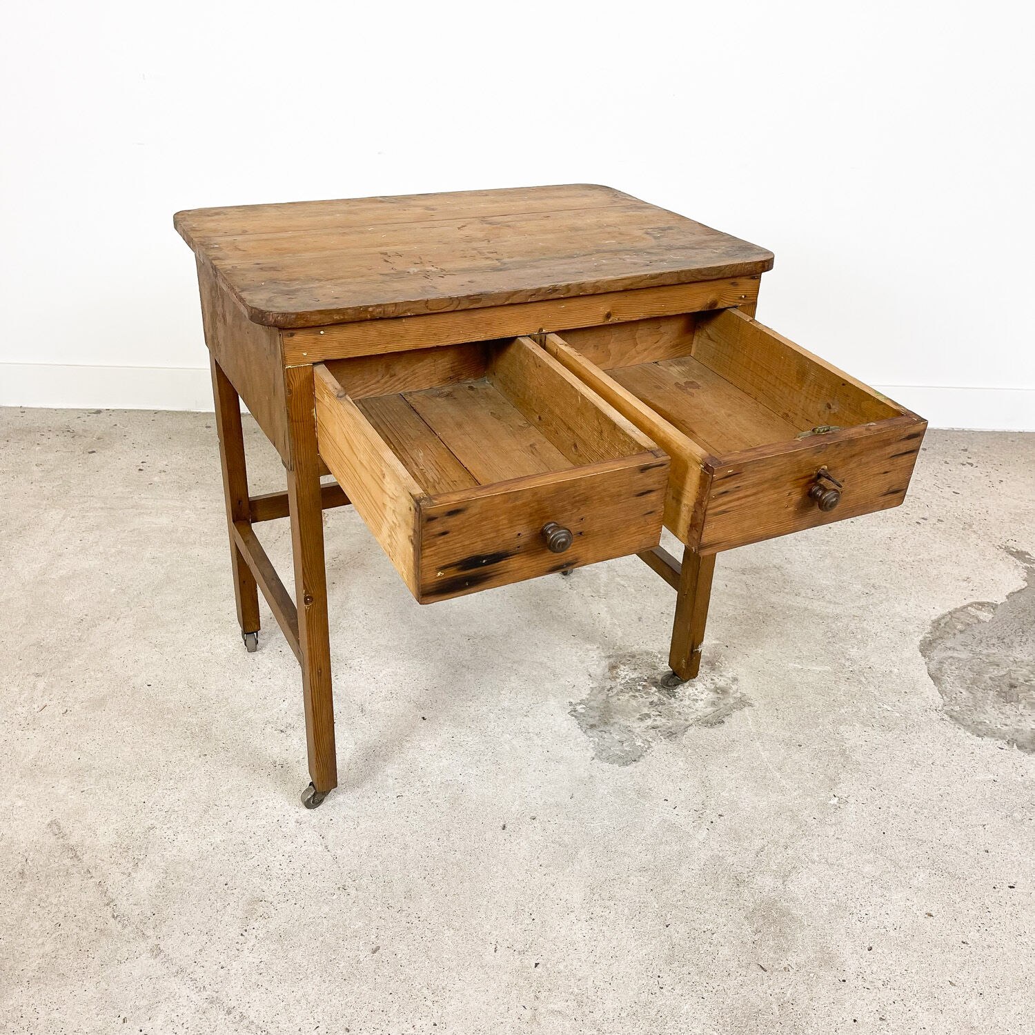Vintage industrial wooden side table with drawers on casters