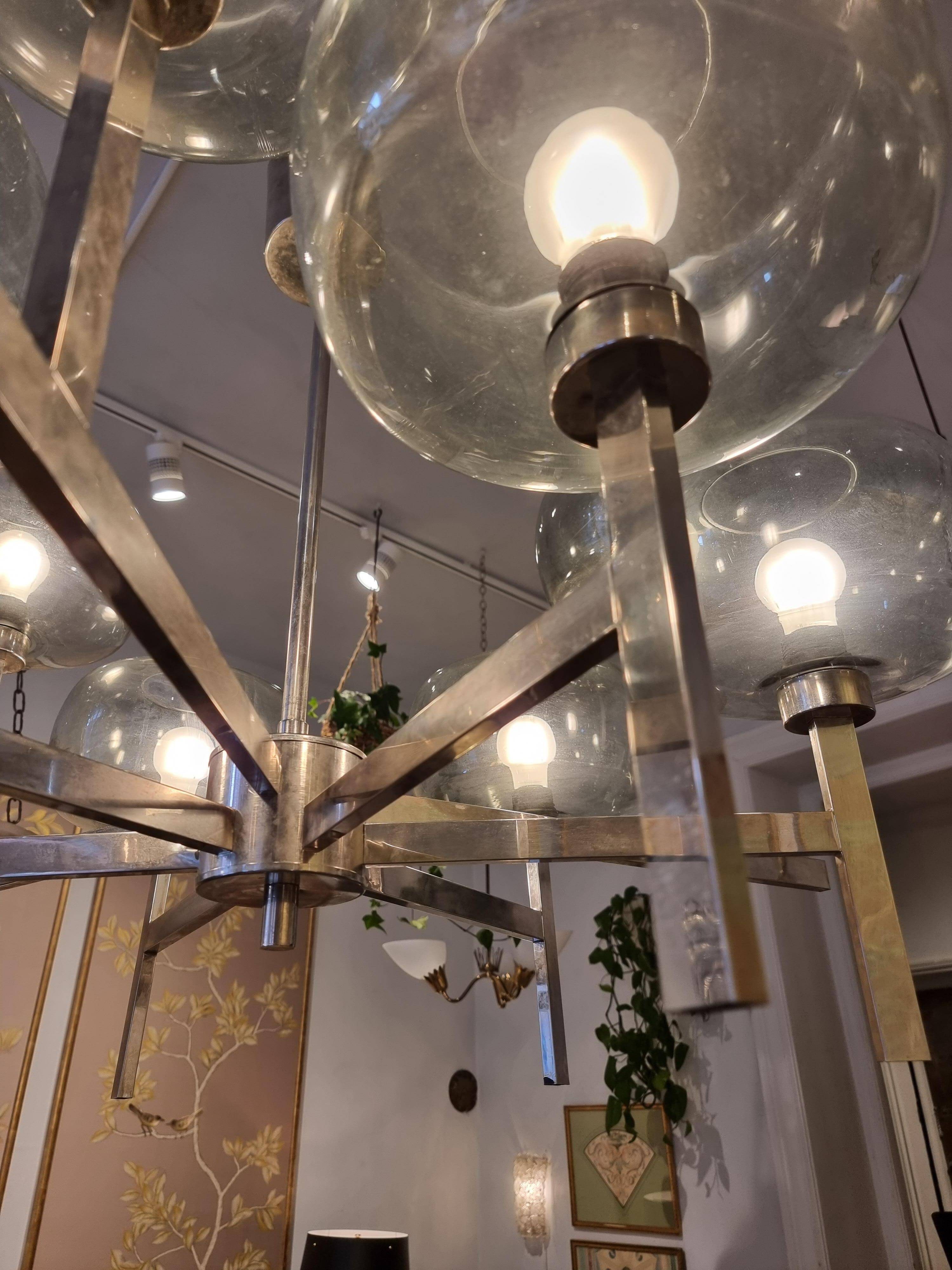 Timeless modern Scandinavian / mid-century chandelier in chrome and smoked glass.