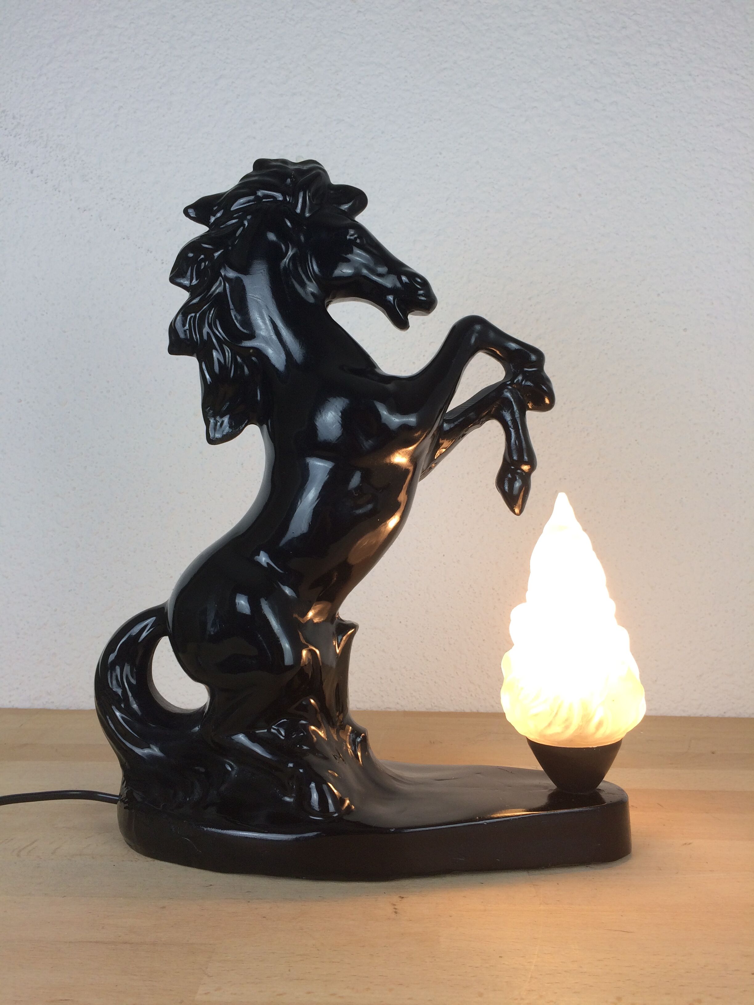Prancing horse lamp and flame