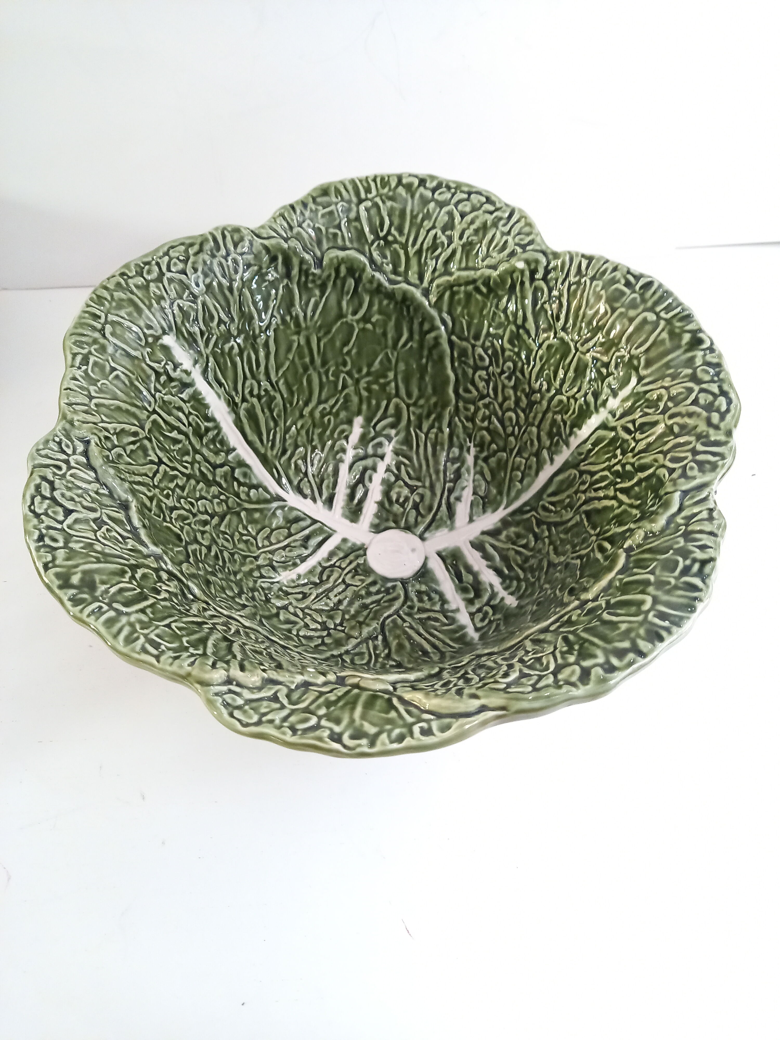Vintage salad bowl in dabbling cabbage leaf and cutlery