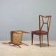 1950s chairs with wooden backs.
