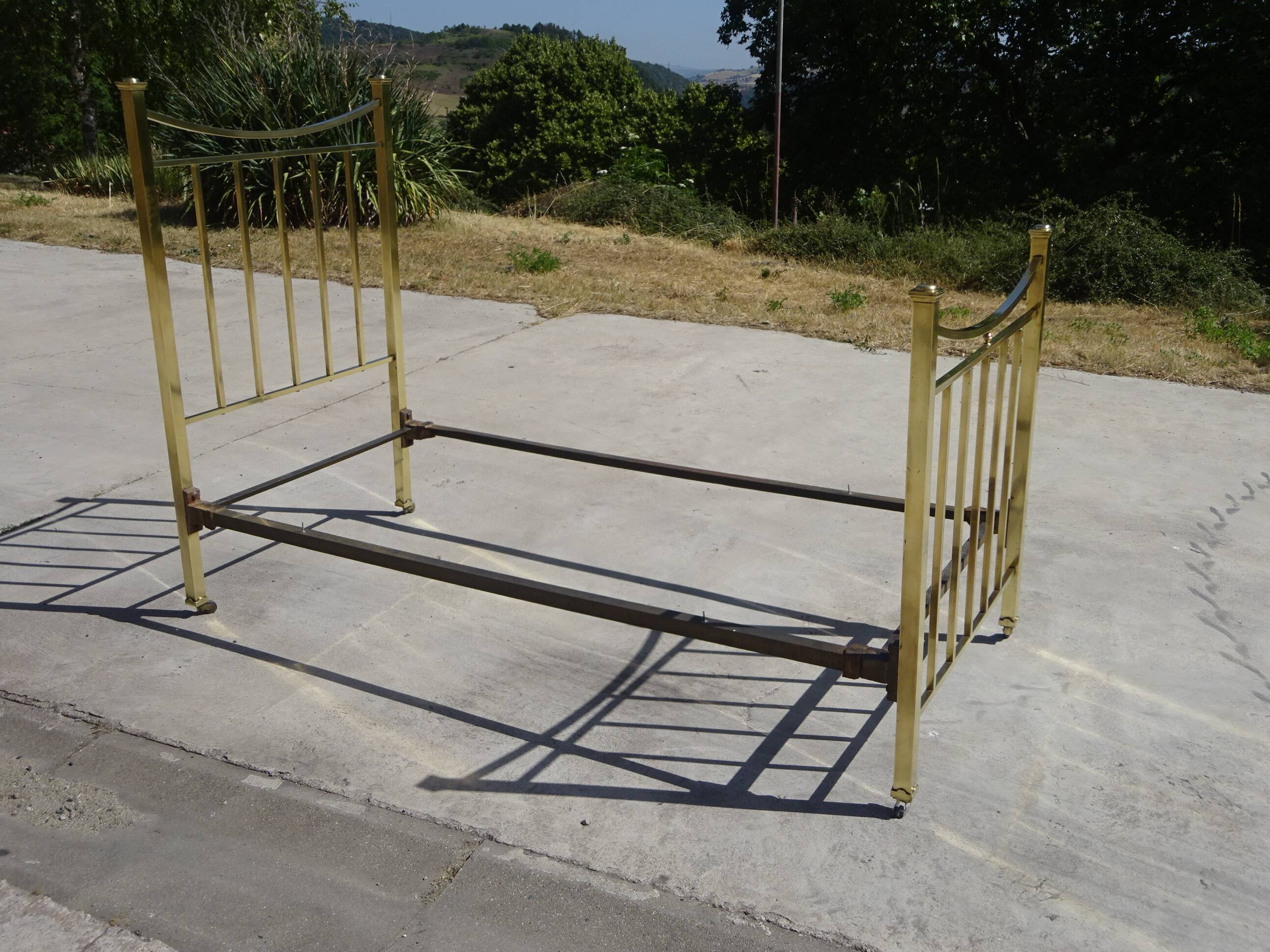 Antique gold-plated brass bed for one person.