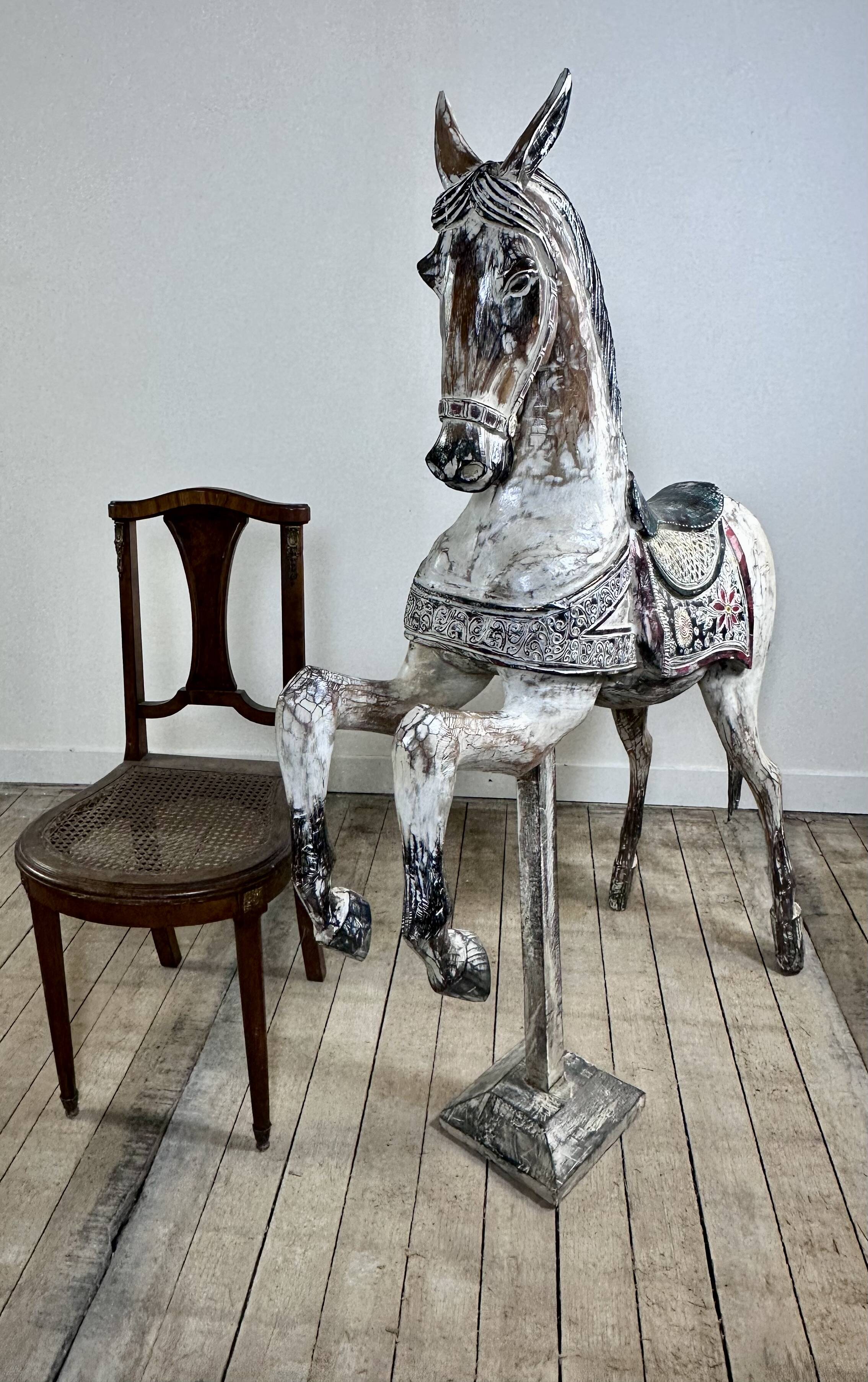 Carved and patinated wooden carousel horse
