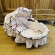 1960s wicker cradle with mattress and drapes.