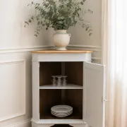 Vintage English corner cabinet enhanced in pearl grey, wooden top.