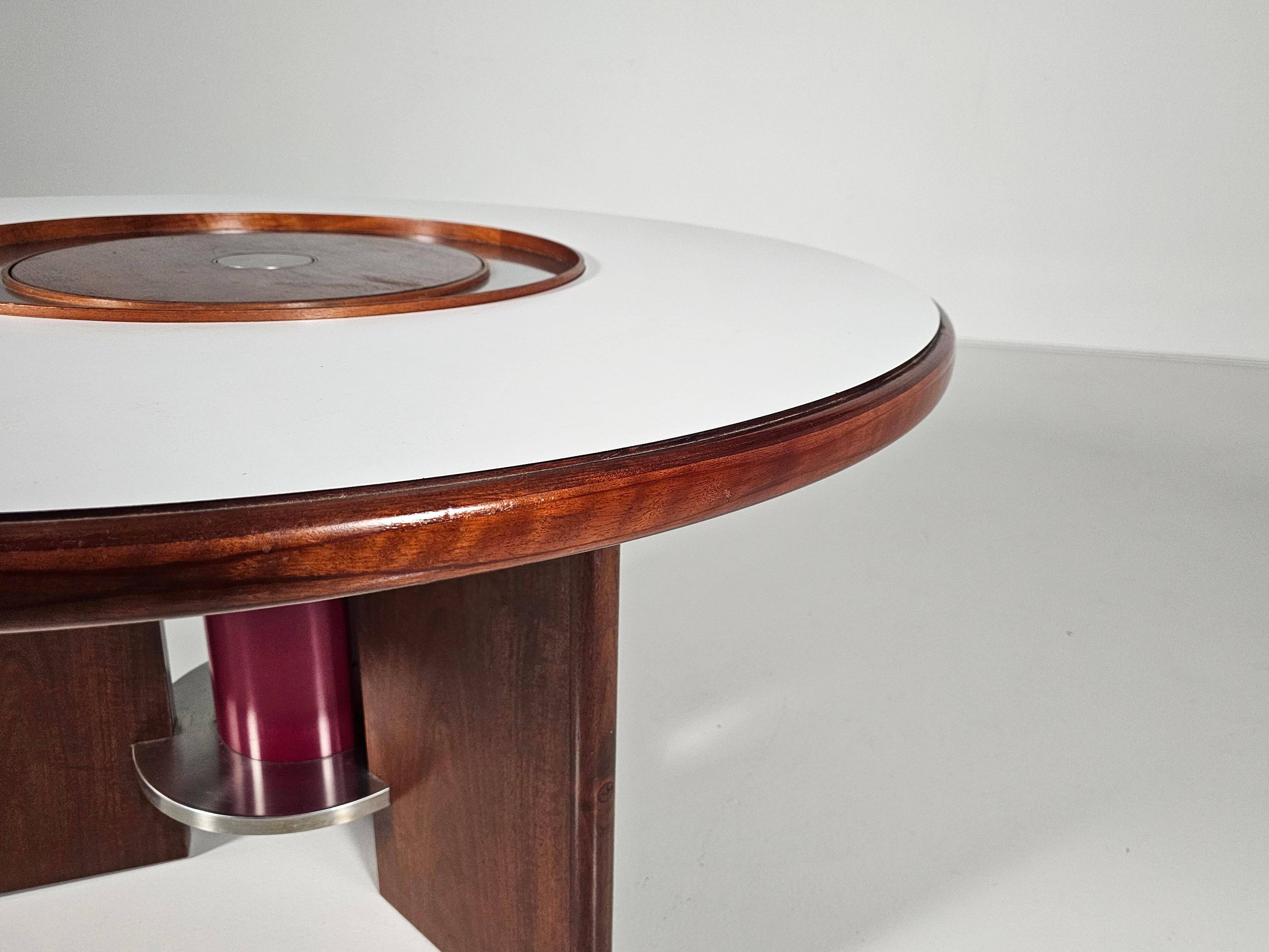 Dining table in walnut, laminate and steel by Silvio Coppola for Bernini, Italy.