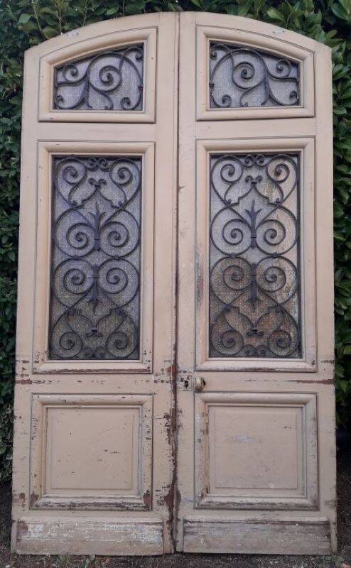19th century double arched entrance door in oak with grilles and old glass