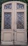 19th century double arched entrance door in oak with grilles and old glass